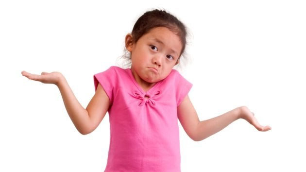 Child shrugging with a confused expression.